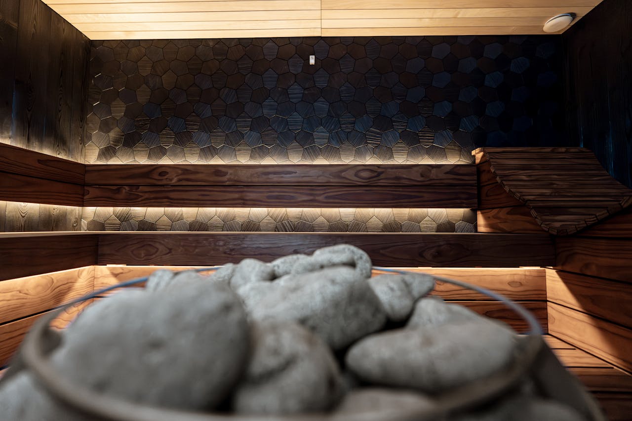 Mastering the First Impression: Your intriguing post title goes here Stylish indoor sauna featuring textured wall panels and warm wood lighting. Perfect for relaxation.